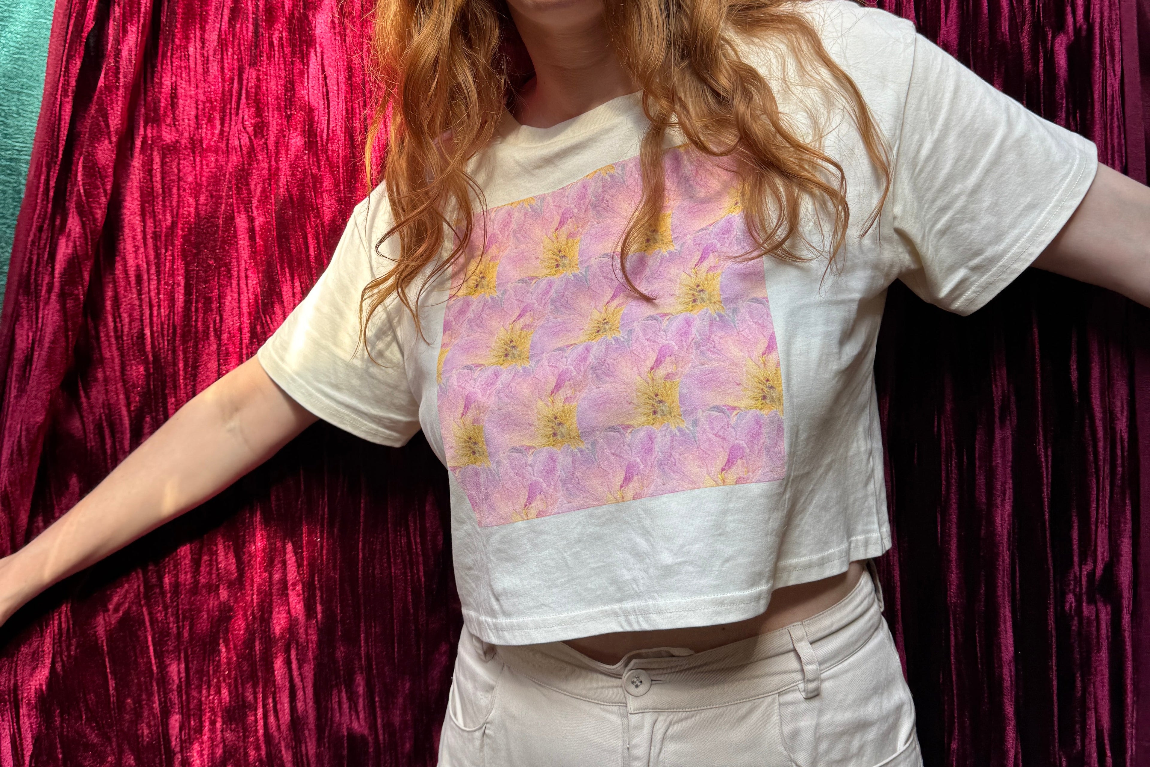 Tara from Old leaf designs Australia wearing a pressed flower crop top with pink peony pattern.