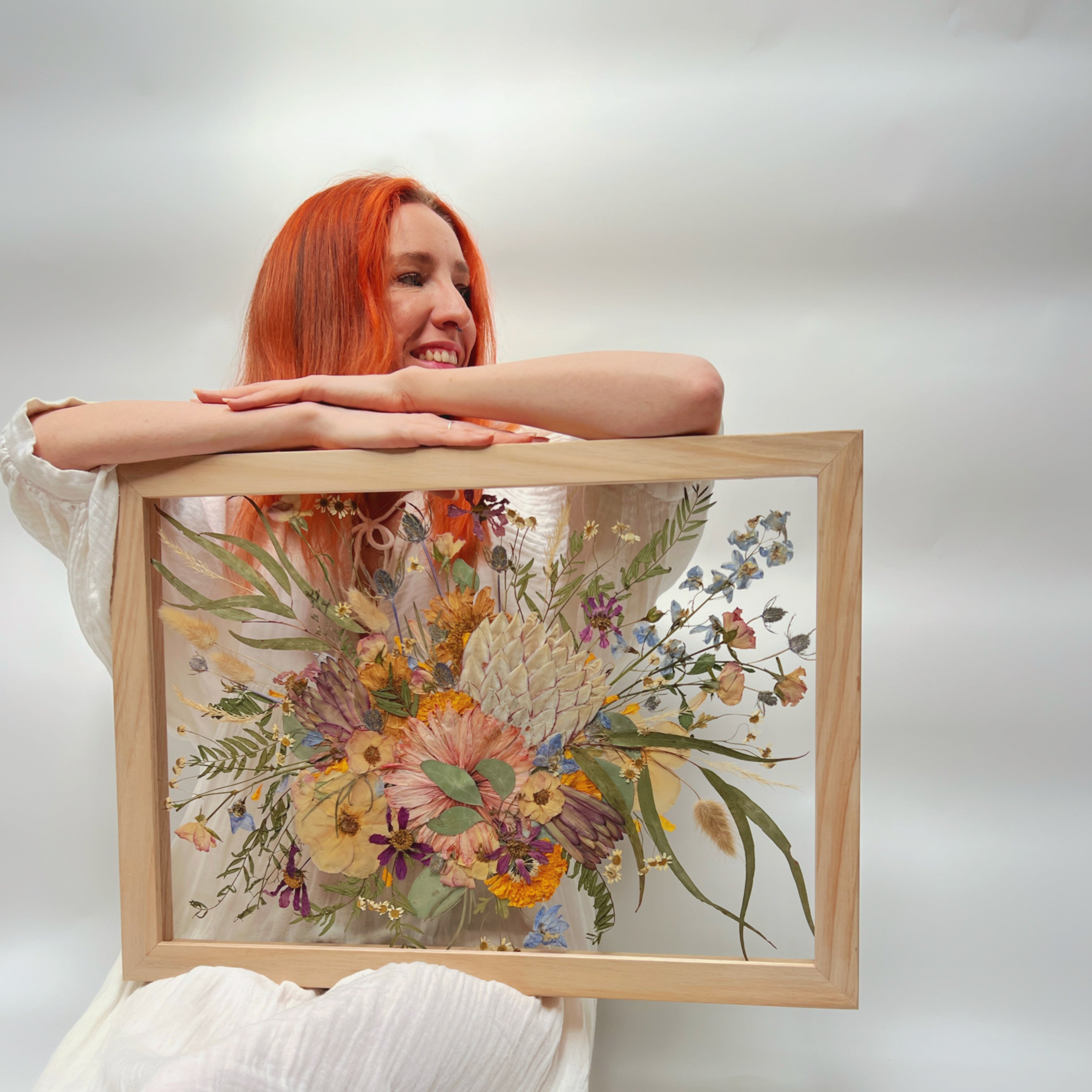 Pressed flower artist from Australias old lead designs with a wedding bouquet pressed Oak a2 frame with protea, garden bouquet 