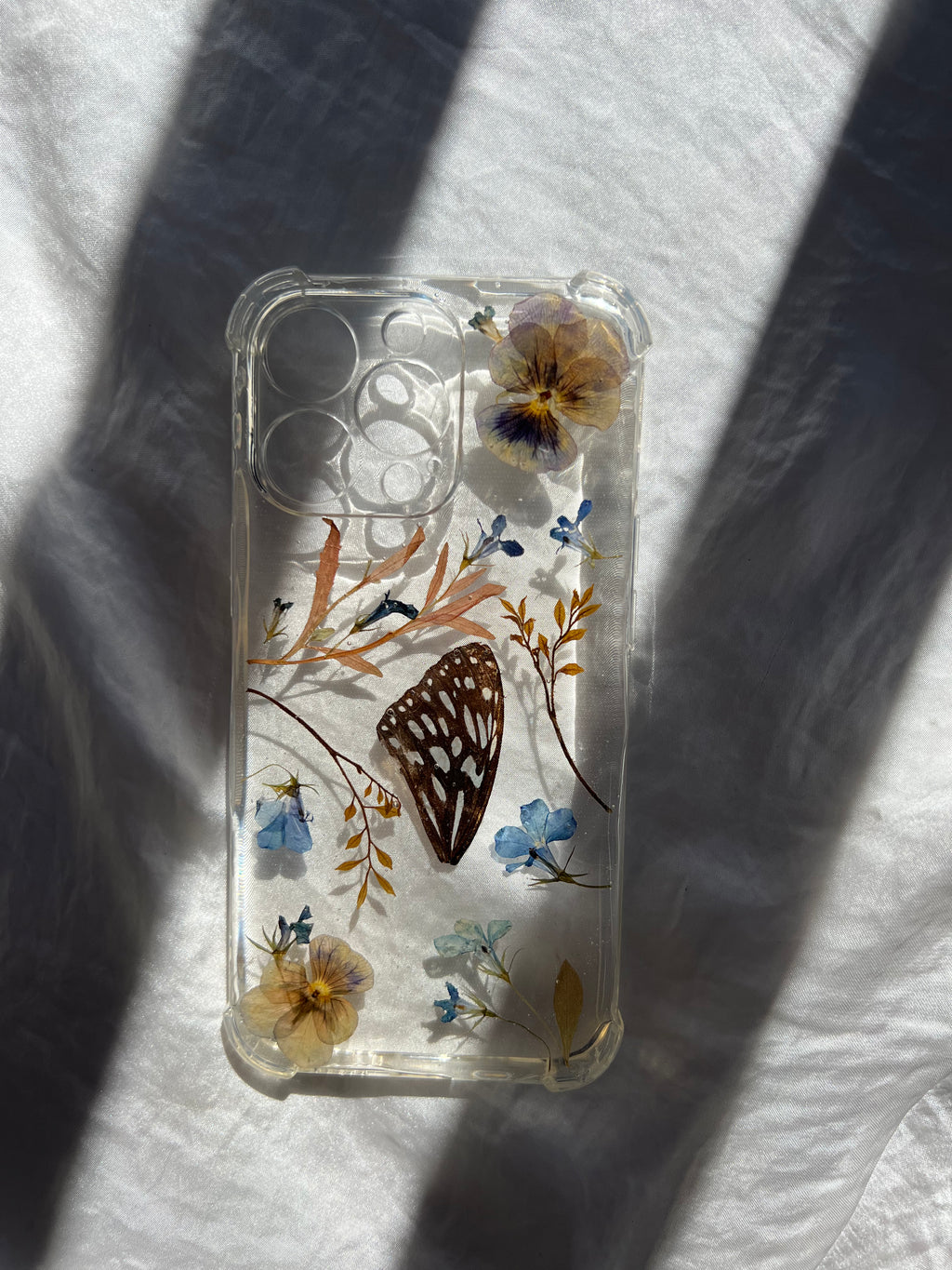 pressed flower phone case, botanical phone case, pressed flower art, handmade phone case, real pressed flowers, australian made, botanical art, pressed flower artist, floral art, botanical preservation, resin and flowers, flowers in resin, phone accessories, iphone 13 pro, iphone case, tweed heads, australian made, gold coast, byron bay, butterfly wing, preserved butterfly